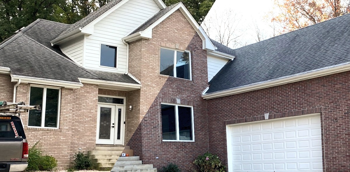 Red brick stained to darker tone — before and after comparison