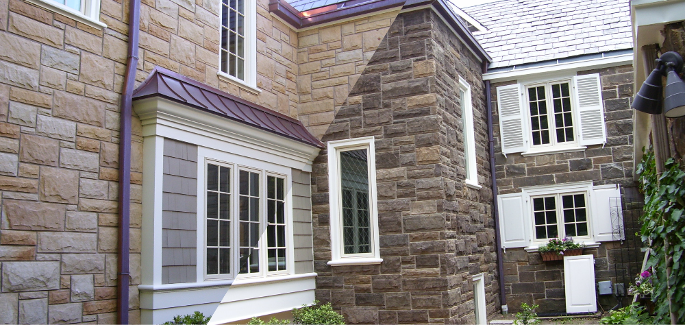 Dark gray stone masonry staining — dramatic color transformation