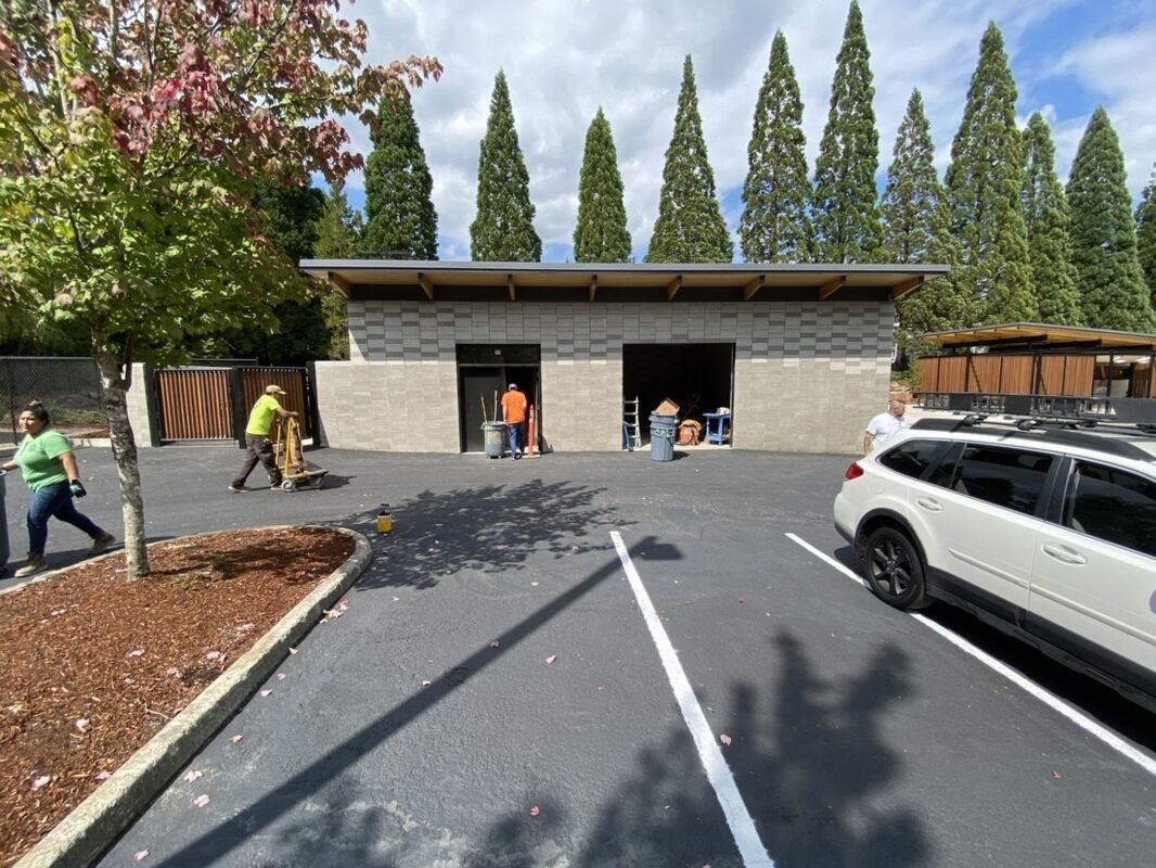 CMU block wall partially stained, Tualatin OR — showing staining process in progress